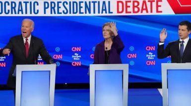 Pete Buttigieg (right) with Joe Biden and Elizabeth Warren in a Democratic presidential debate