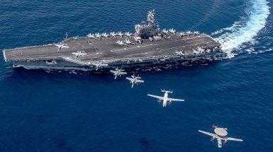Multiple aircraft from Carrier Air Wing 5 fly in formation over the Navy’s forward-deployed aircraft carrier USS Ronald Reagan in South China Sea, October 2019